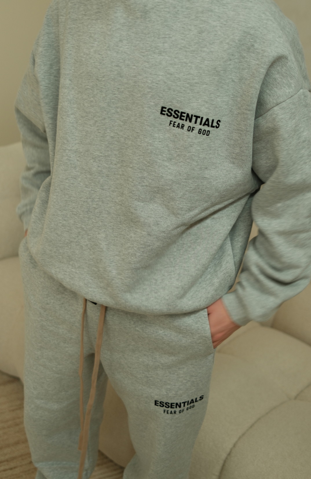 Fear of God Essentials mens fleece crewneck in heather grey front view