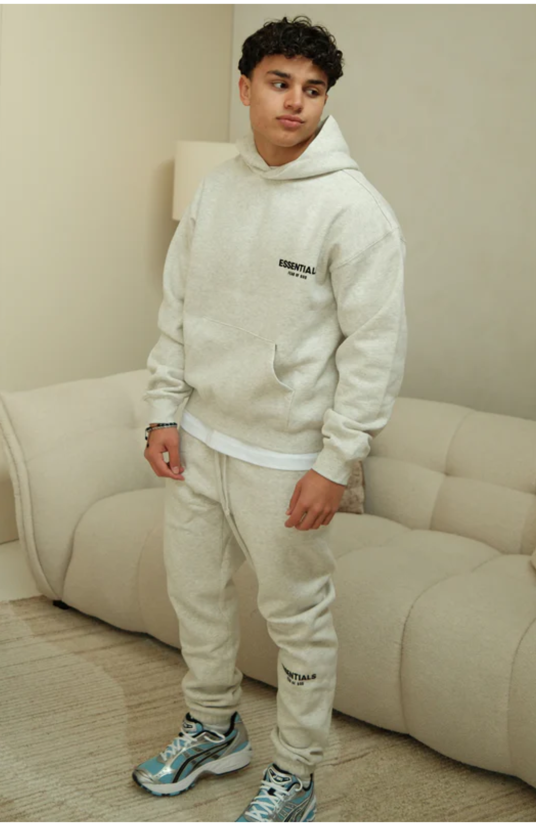 Fear of God ESSENTIALS Light Oatmeal Full Set hoodie and sweatpants set in light oatmeal worn by model