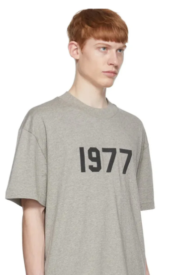 Fear of God Essentials 1977 Dark Oatmeal Summer Set t-shirt in dark oatmeal worn by model detail view