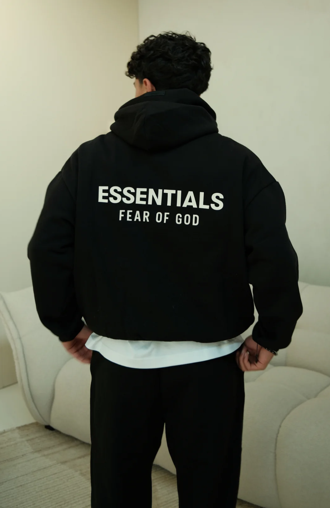 Fear of God ESSENTIALS hoodie in black white back view
