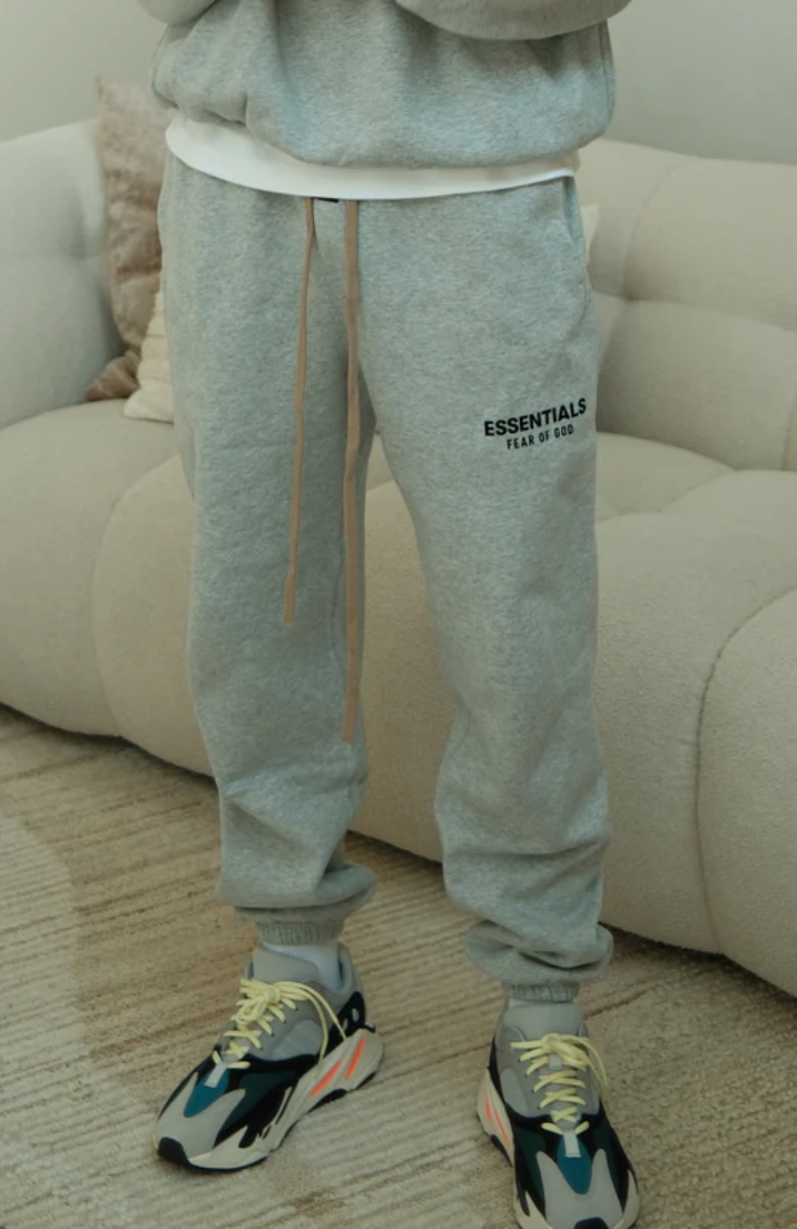 Fear of God Essentials FW24 Light Heather Full Set sweatpants in light heather worn by model detail view