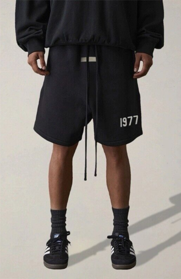 Fear of God Essentials Limo Black Full Set shorts in limo black worn by model