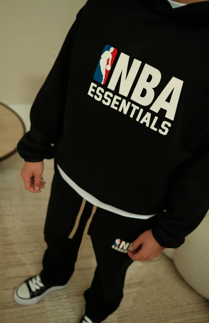 Fear Of God Essentials NBA Black Full Set sweatpants in black worn by model