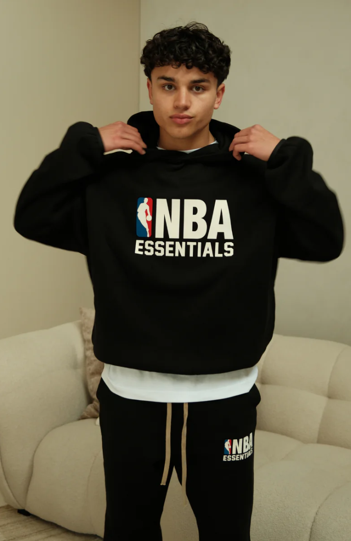 Fear Of God Essentials NBA Black Full Set hoodie in black worn by model