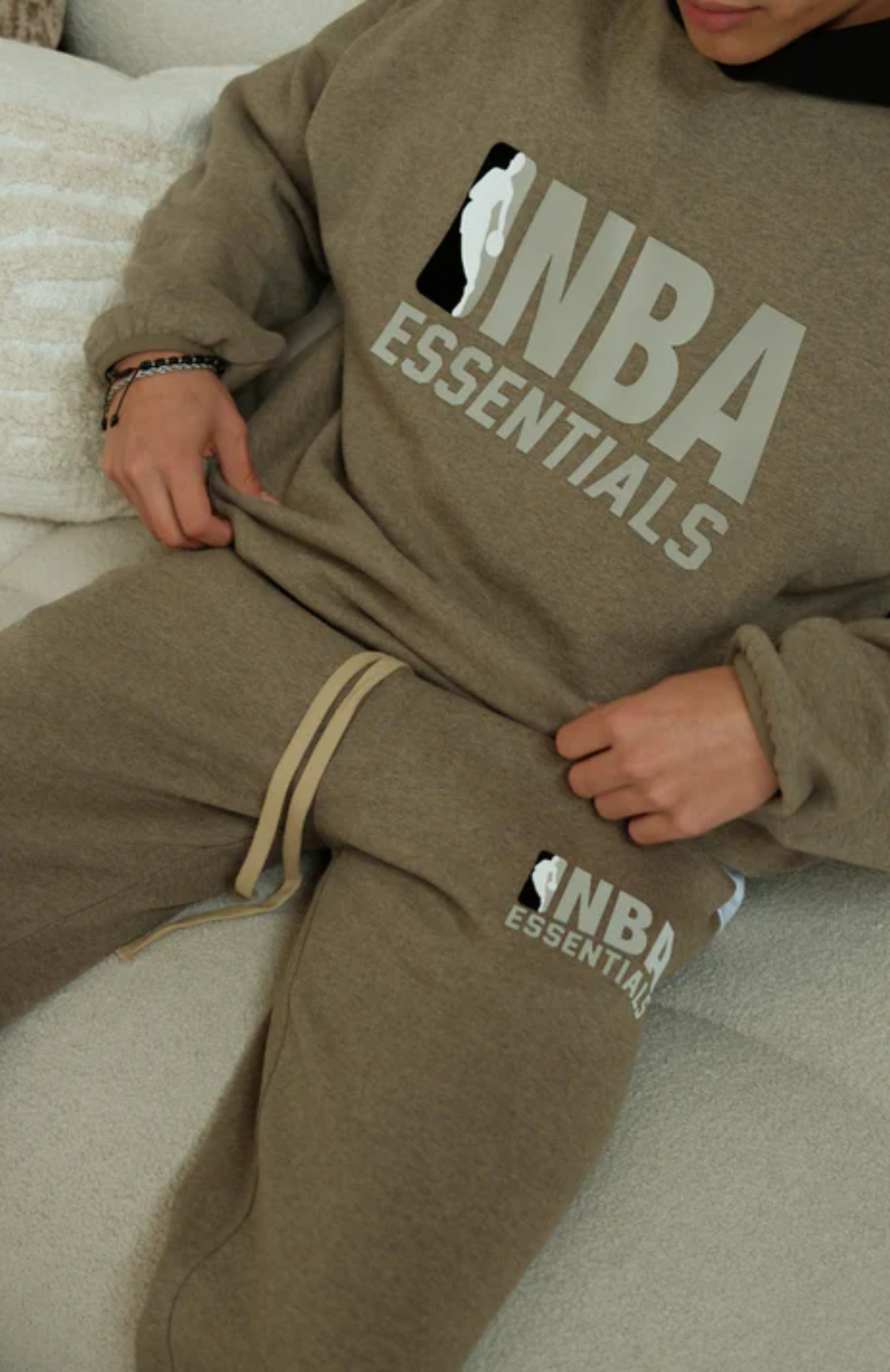 Fear of God ESSENTIALS NBA hoodie and sweatpants set in warm heather worn by model detail view