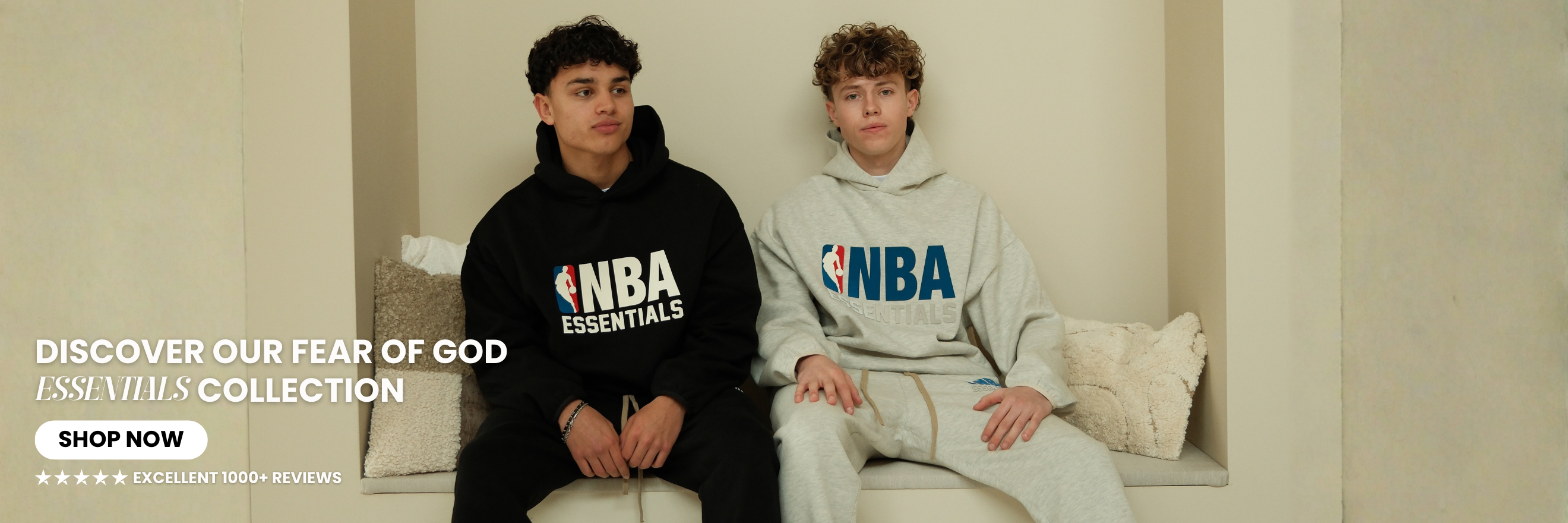 Website banner featuring Fear of God Essentials hoodie and sweatpants sets worn by models in black and grey